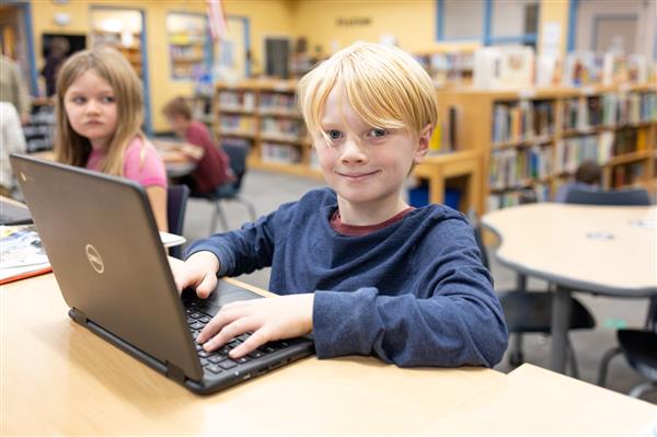 Student with books inside the library